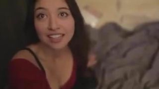 Asian babe in a red dress gives a blowjob